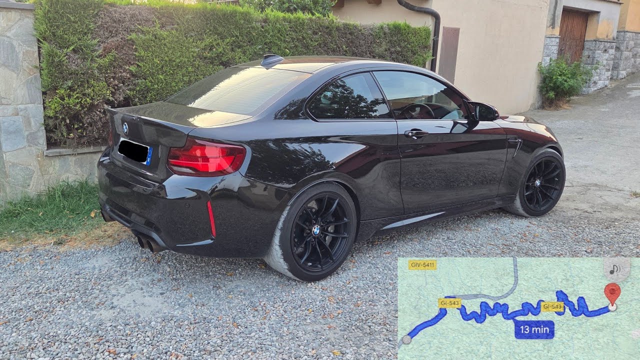 Driving Bmw M2 Competition on mountain road