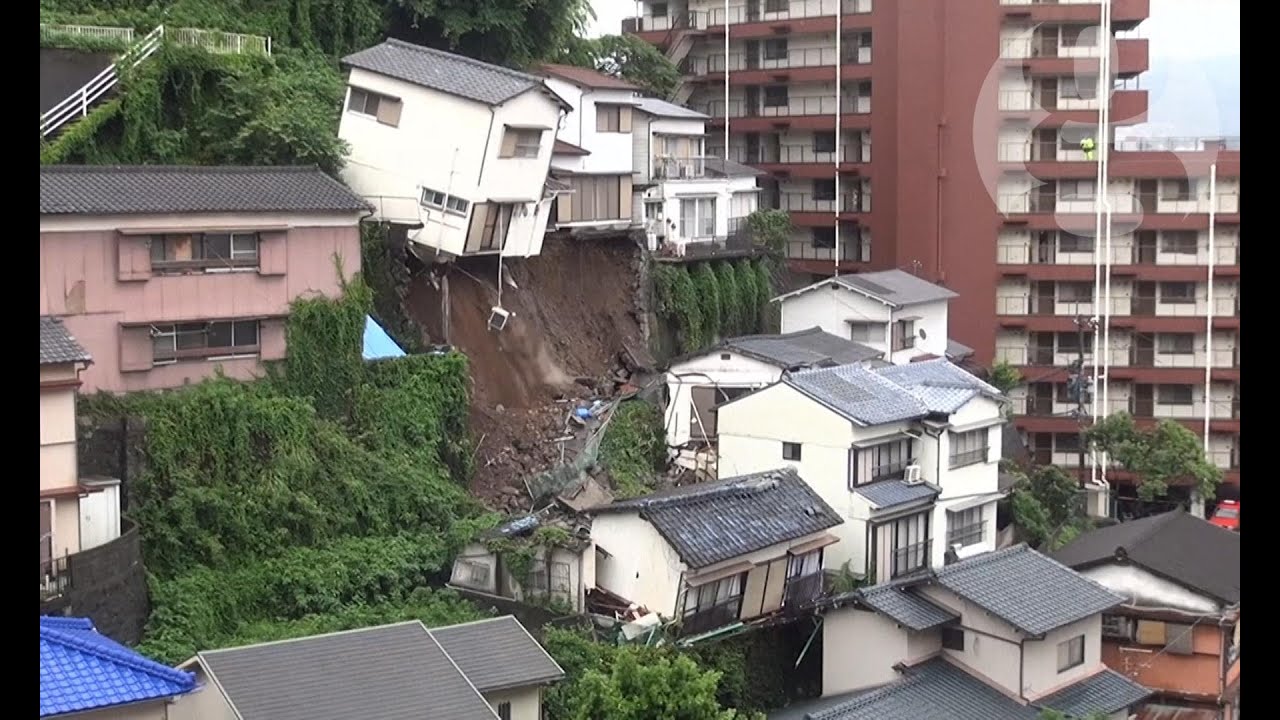 House crashes down hill after Japanese mudslide