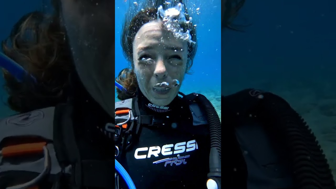 females scuba divers talking underwater