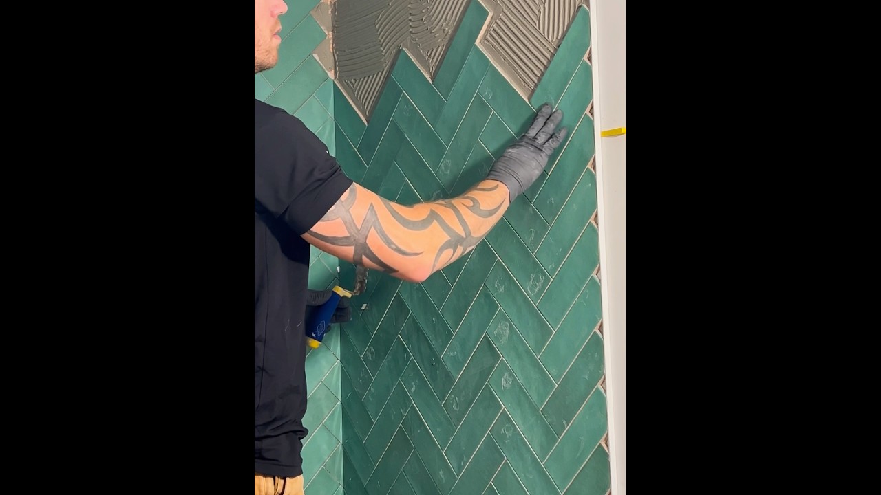 How to install tile in a herringbone layout #bathroomtiles #diy #tiletransformation #bathroom