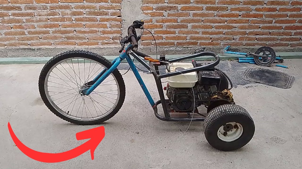 Triciclo motorizado 6.5hp hecho de un cuadro de bicicleta vieja