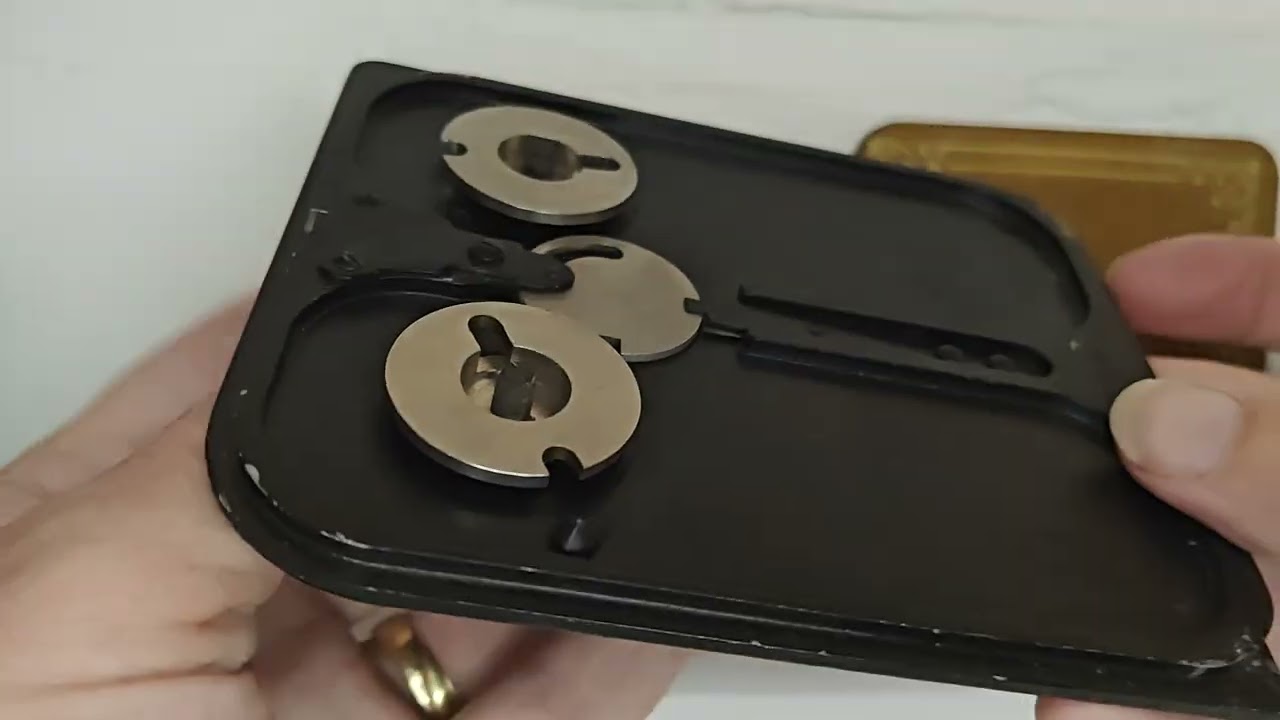 Opening the film compartment of a Rokuoh-Sha Type 89 aerial camera.