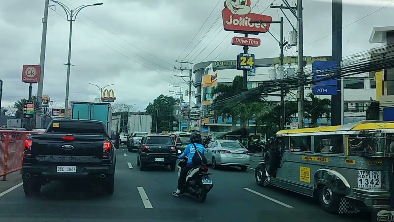 Near Missed cargo trucks in front moved back inch away in the middle of heavy traffic.
