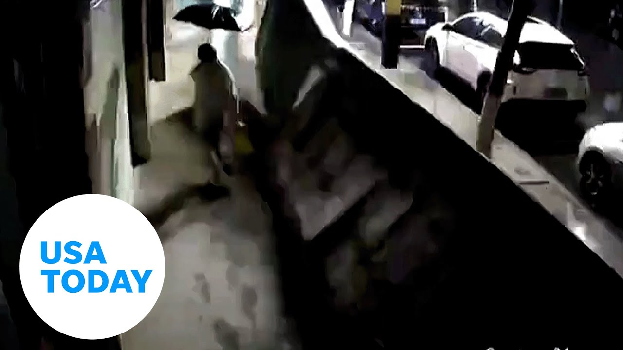 Woman barely escapes serious injury when billboard crashes down | USA TODAY