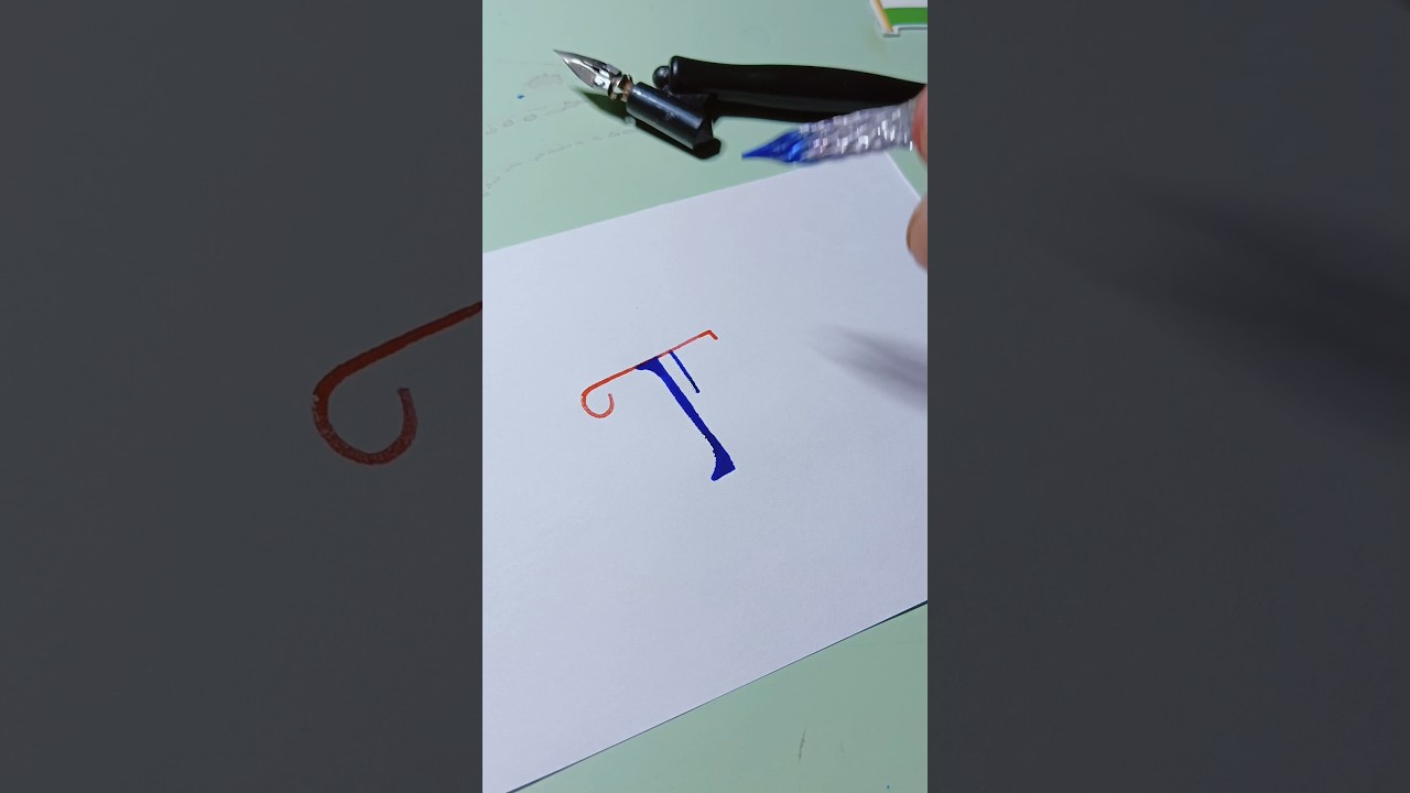 Glass pen calligraphy using word T 