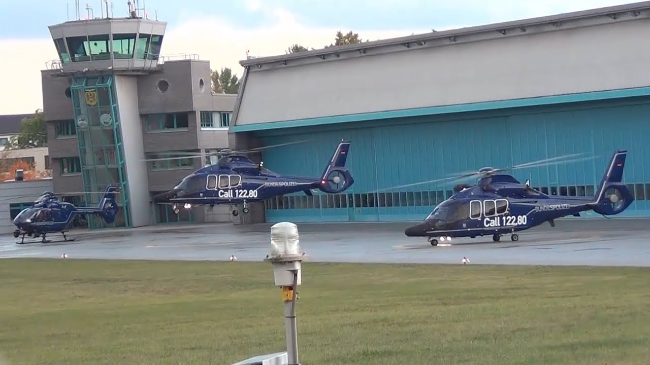 Two police helicopters EC 155 take off  