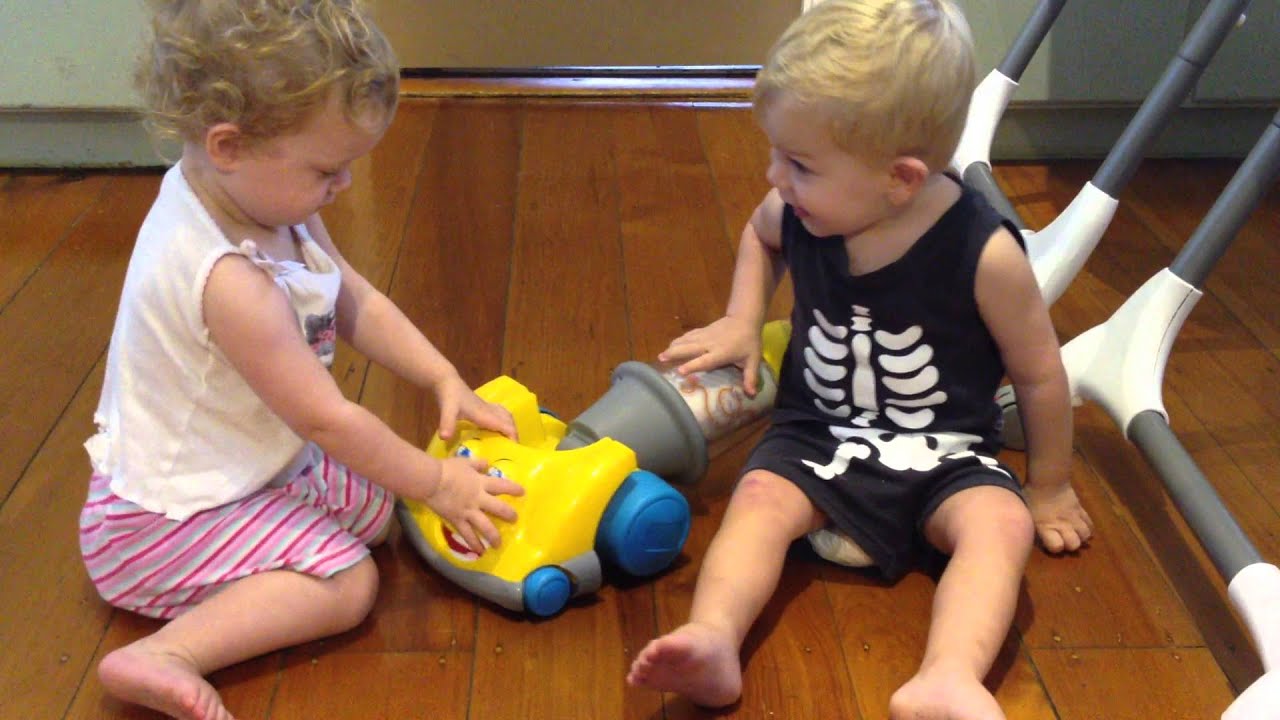 Twins vacuuming & fighting over it