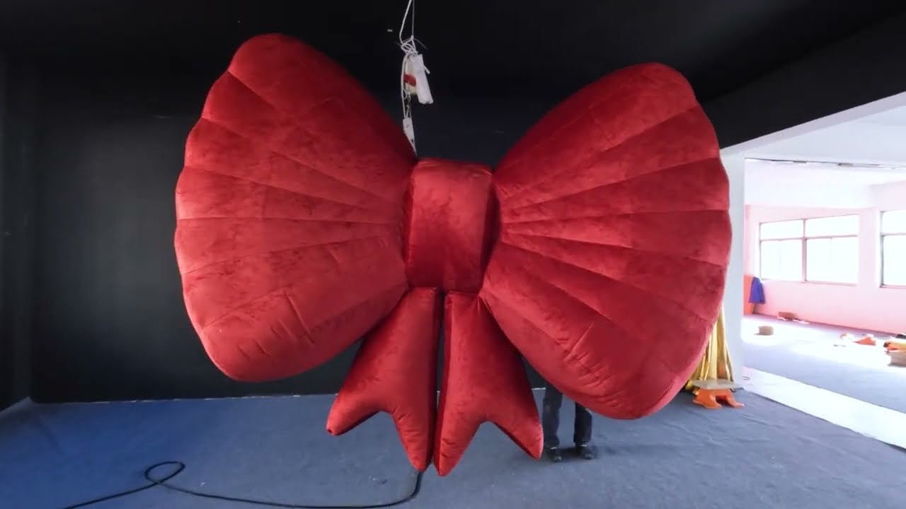 Red InflatableBalloon Bow for #AdvertisingInflatables #Stagedesign Gorgeous backdrop Decor