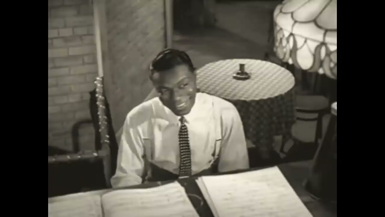 Nat King Cole, Eartha Kitt, and Cab Calloway in a scene from 'St Louis Blues' (1958).