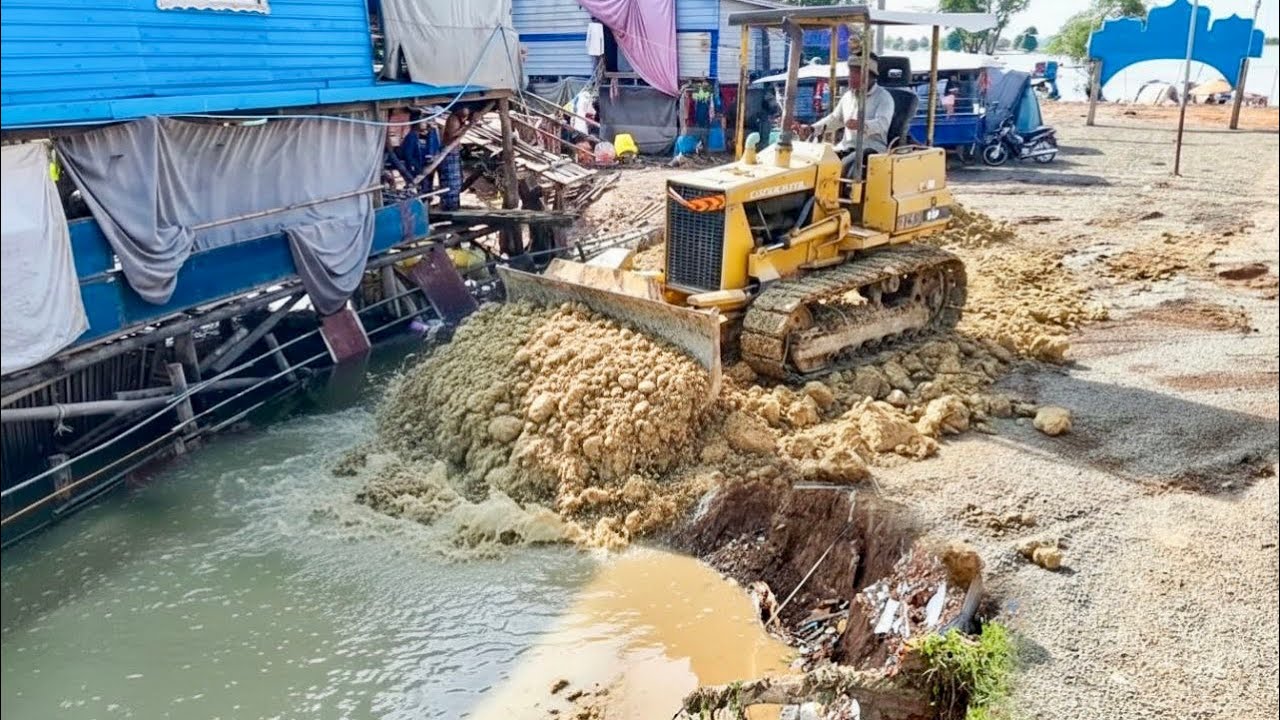 Start Opening New Project!!KOMAT'SU BD2A Bulldozer  pushing Soil into Dirty water& Trucks​ 5Ton.