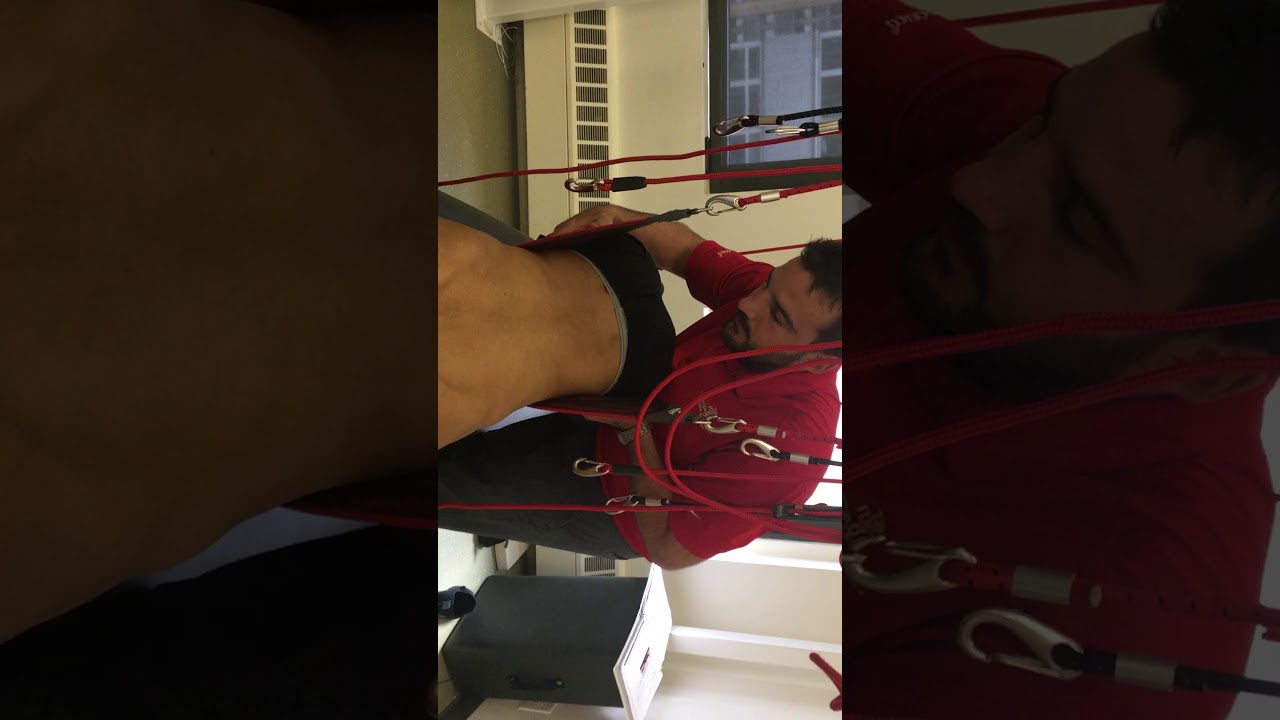 Redcord Neurac Therapy exercises. Athletic back injury. NYDN Rehab.