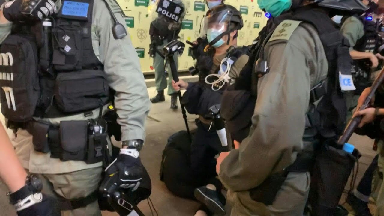 Woman arrested at Hong Kong rally | AFP