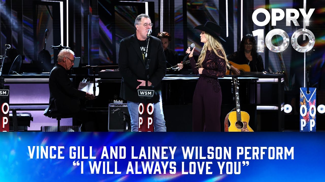 Винс Гилл и Лейни Уилсон исполняют песню «I Will Always Love You».