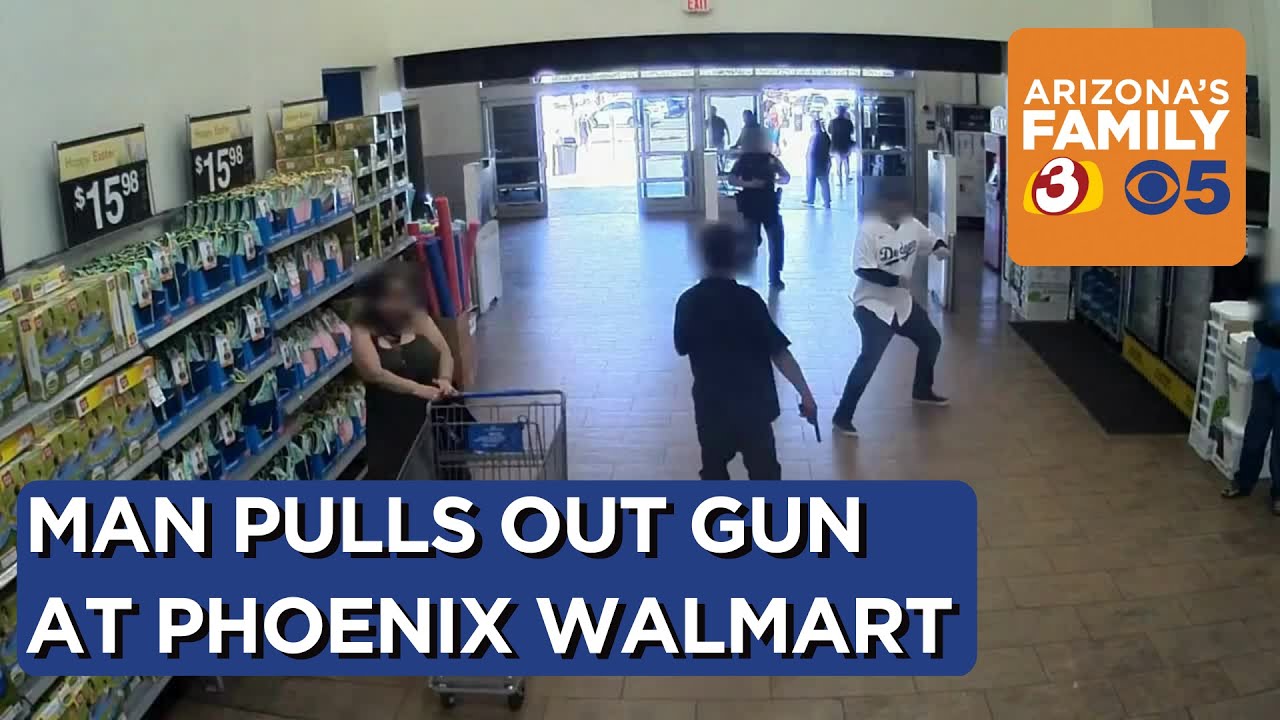 GRAPHIC: Man points gun at Walmart employee, Phoenix officer