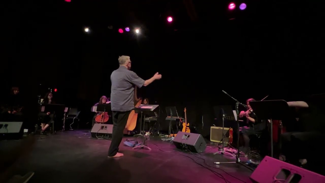 Fred Frith playing with & conducting the Modern Currents Ensemble. 