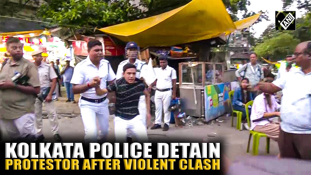 Kolkata Police detain protestor after stone pelting during clash with protestors at Park Street