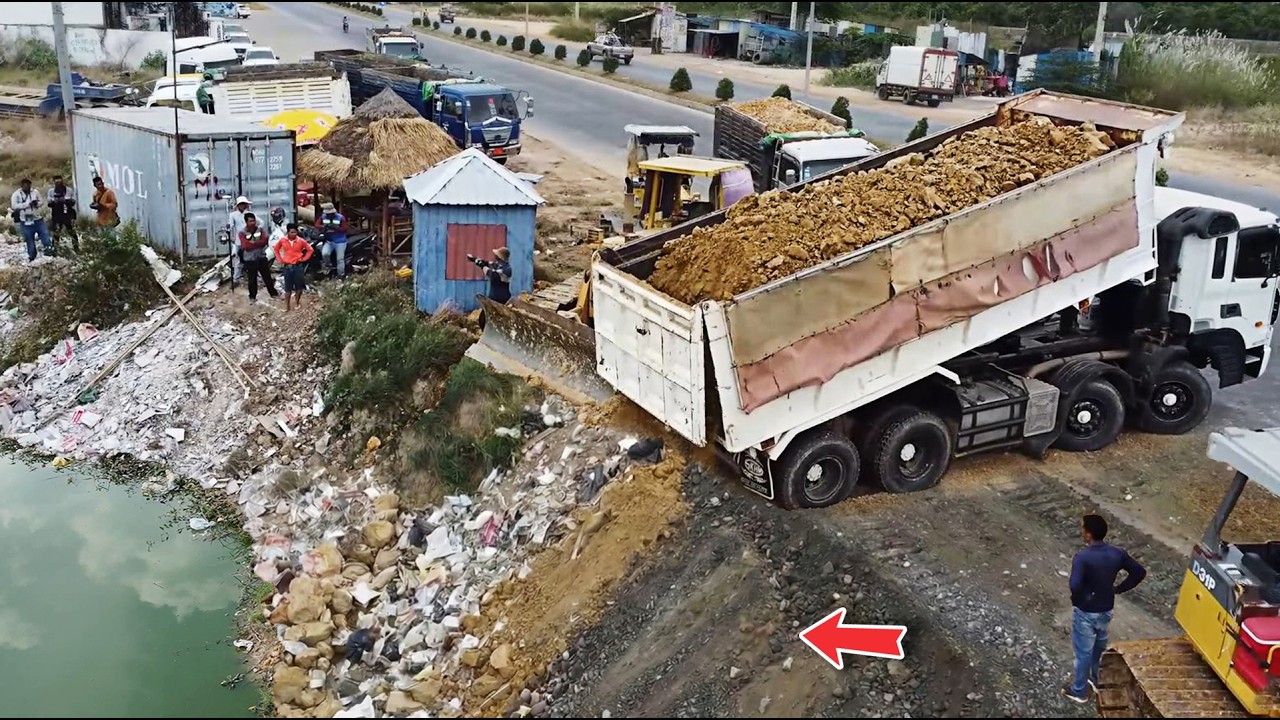 Process Great Working!! Talented Dump Truck Drop Soil fill Huge flooded area & Push by KOMATSU Dozer