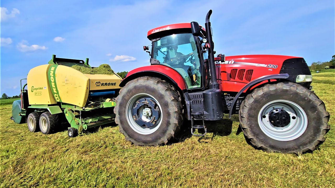 Case IH 230 PUMA mit KRONE Comprima CF 155 XC Rundballenpresse packt ein!