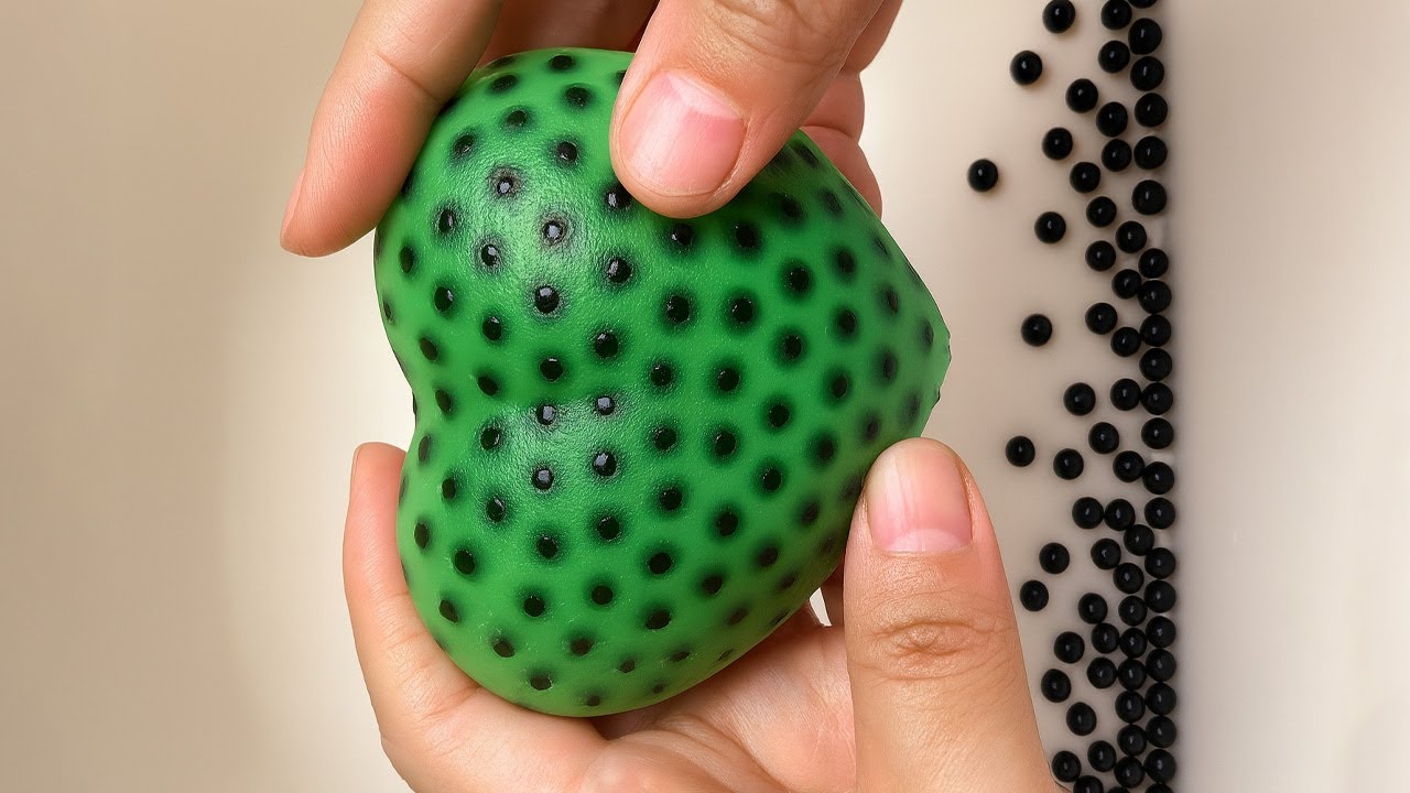 Millions of Black Beads Inside! The Ultimate Stress Ball Pressing