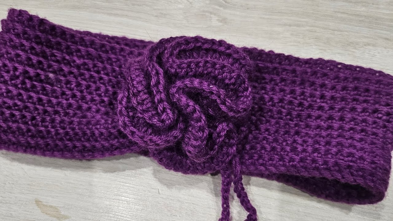 Fascia/collo con fiore regolabile