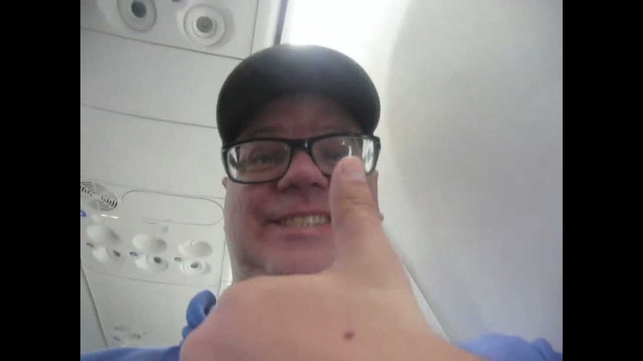 Going onto plane YYZ & On plane at seat YYZ & Sitting in seat plane switched to Swoop