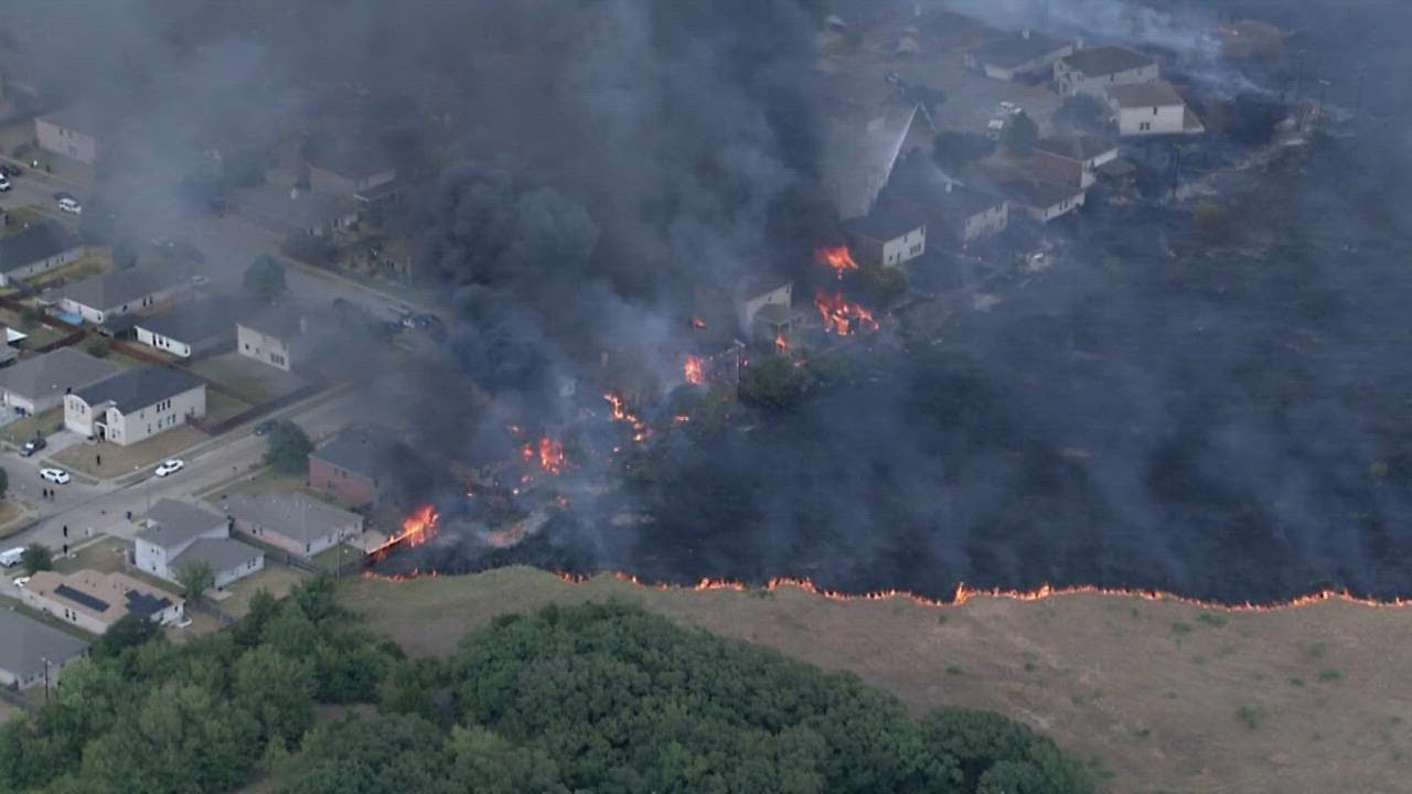 Crews battling growing grass fire in Balch Springs neighborhood; people in nearby hotel evacuated