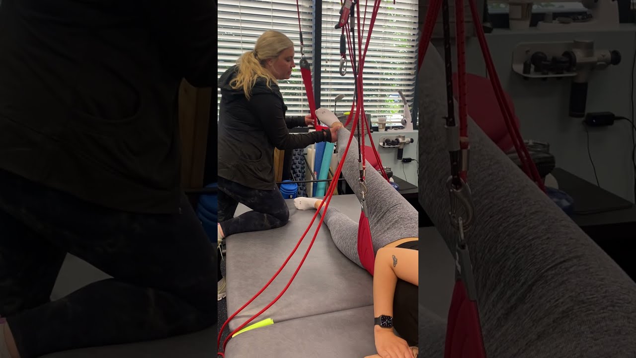 Redcord Hip Adduction with bungee assistance.
