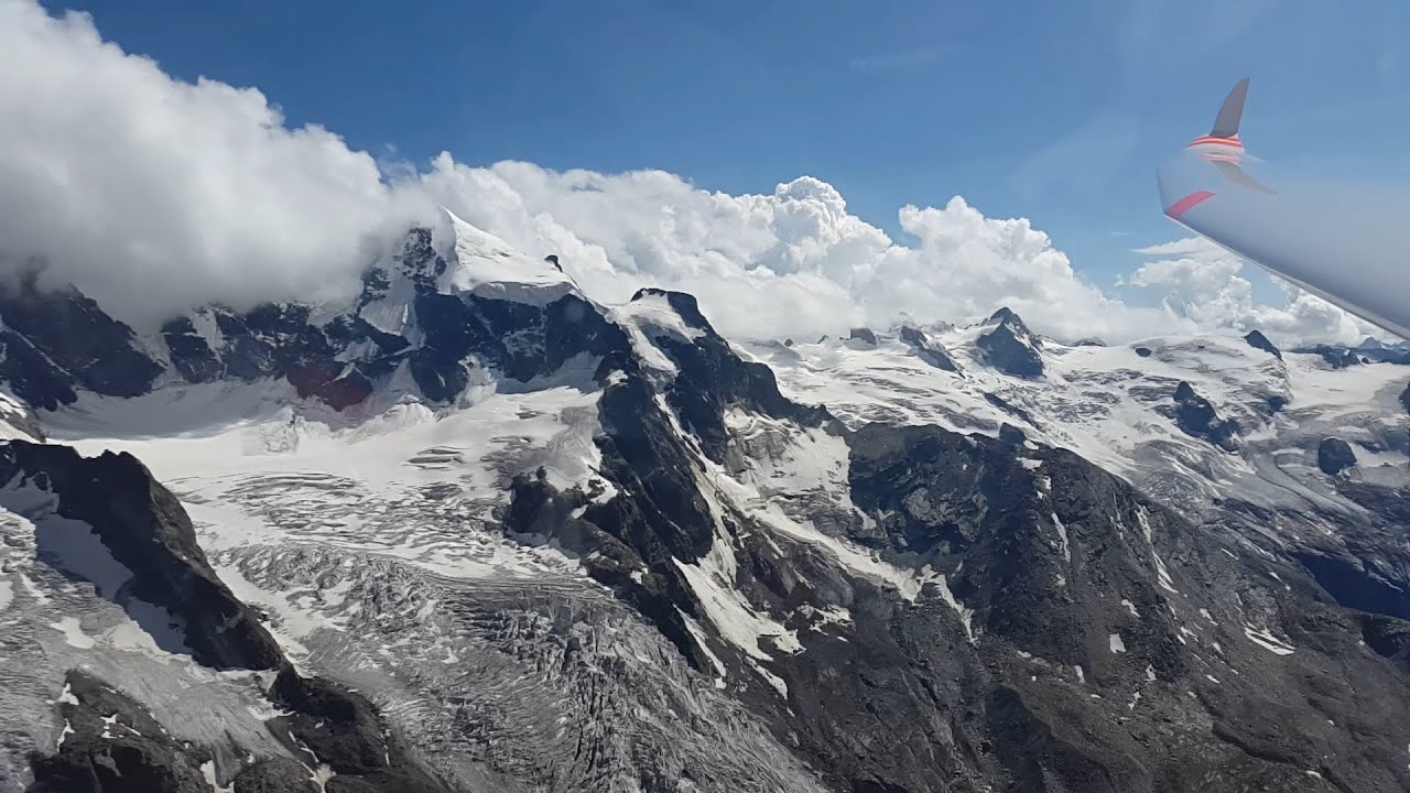 Glider flight near glacier in Samedan, Switzerland