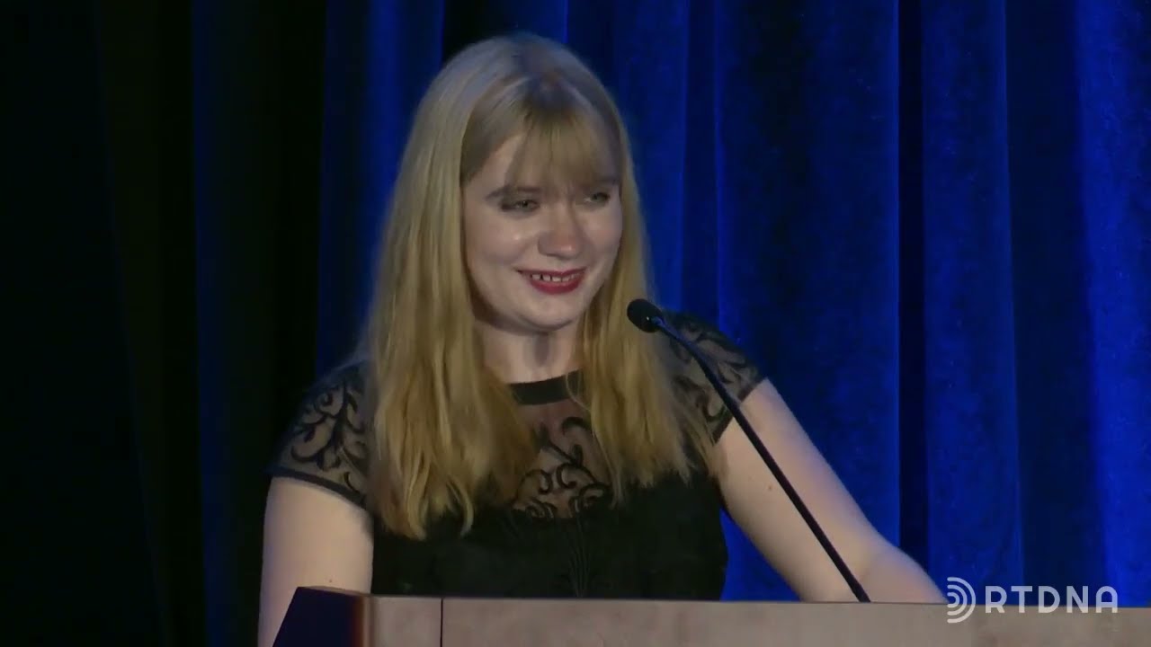 Hilde Lysiak accepts the RTDNA Foundation's 2023 First Amendment Award