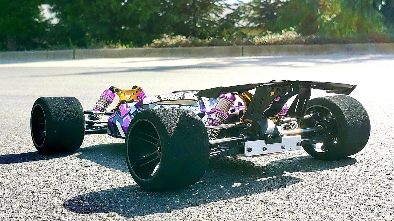 Wltoys 124019 custom wide rear suspension stock brushed first run on 2s