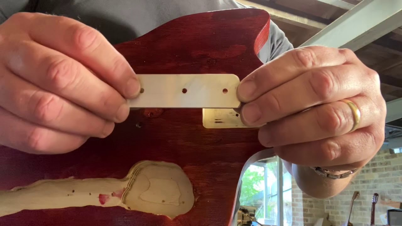 Making a neck plate for a solid body Electric or cigar box guitar