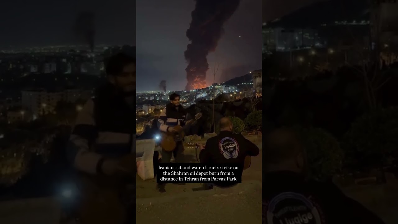 Iranians sit and watch Israel&rsquo;s strike on the Shahran oil depot burn from a distance #iran