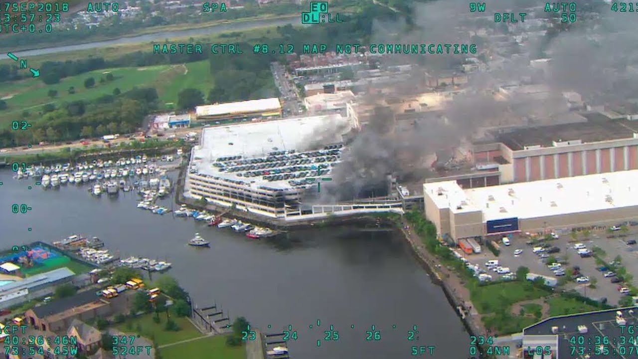 Hundreds of Firefighters Rush To Massive Parking Garage Fire