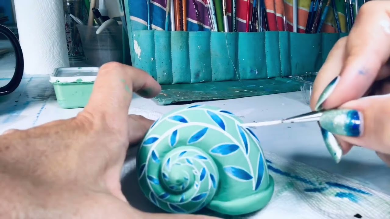￼Painting a snail shell with acrylics