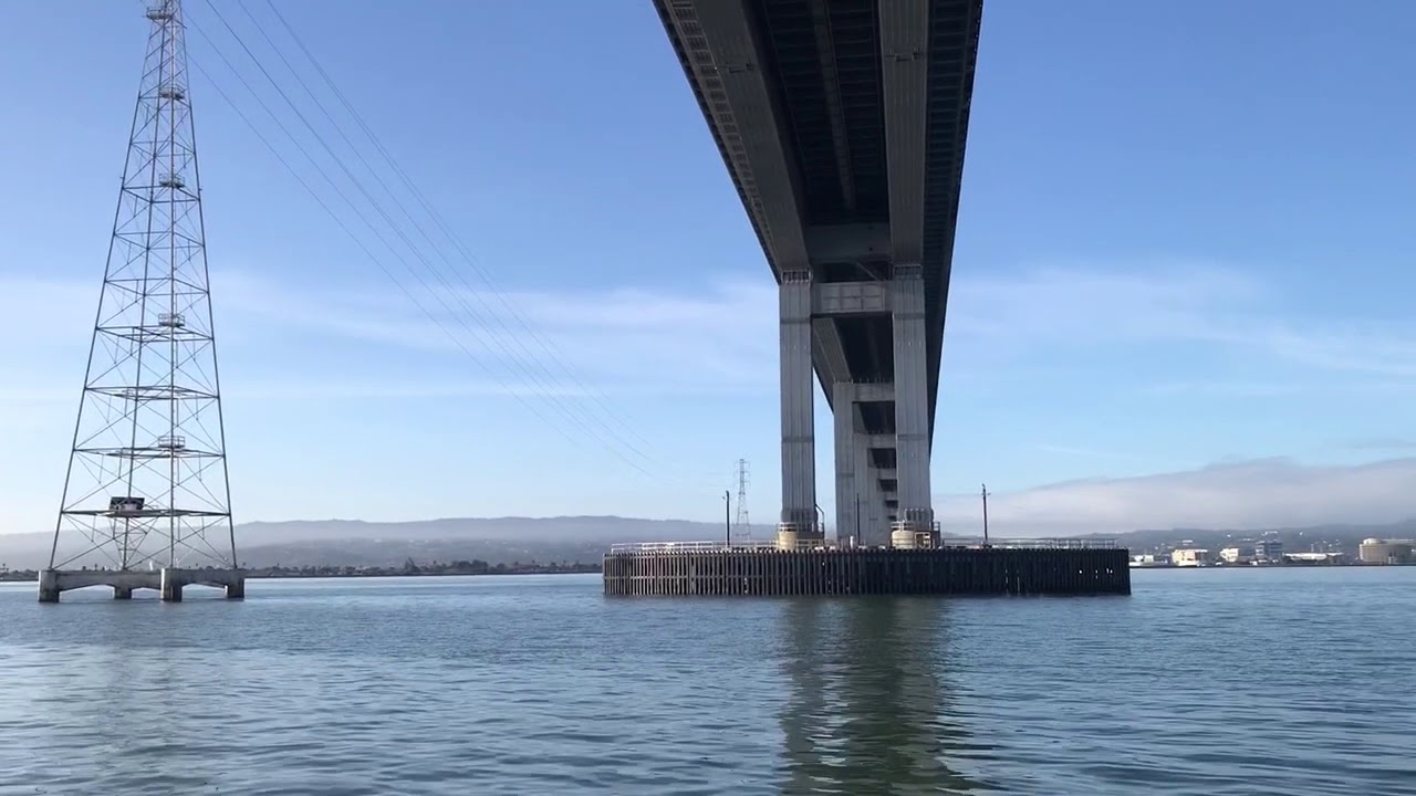 single hand sailing Morgan 382 s/v hokulea under San Mateo bridge