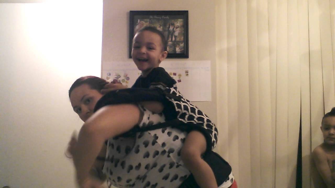 Back carry in a Tula with a hip scoot