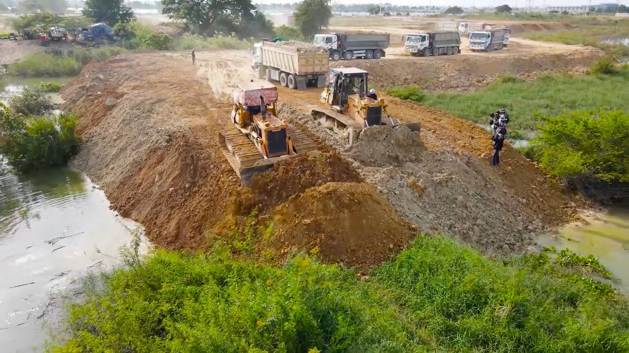Fantastic Powerful Talented Bulldozer KOMASTU Push Soil and Heavy Dump Truck  Moving Soil into Water