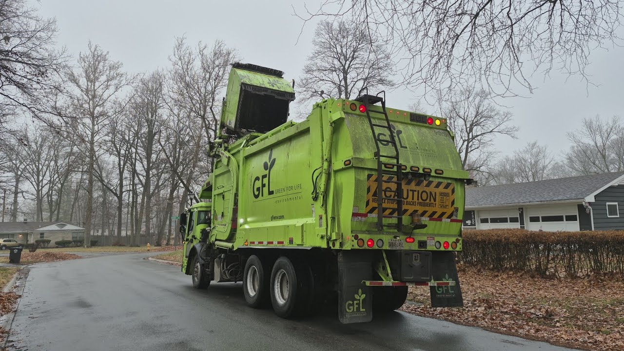 GFL: Mack LR Curotto can on heavy post Christmas trash