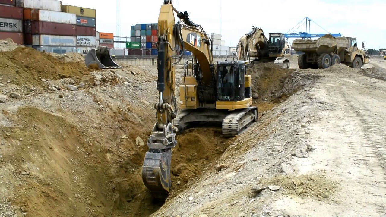 Caterpillar 321D-LR and 330D digging a trench