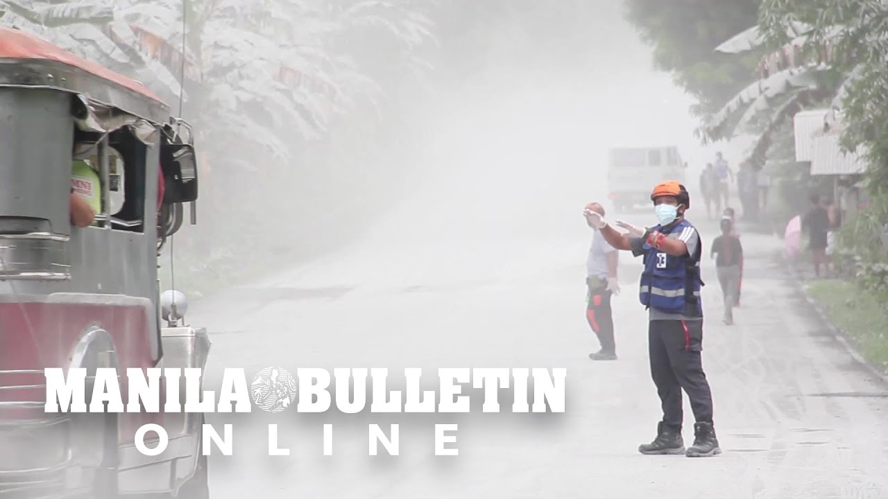 Residents clean up ash-covered houses after Philippines volcano erupts