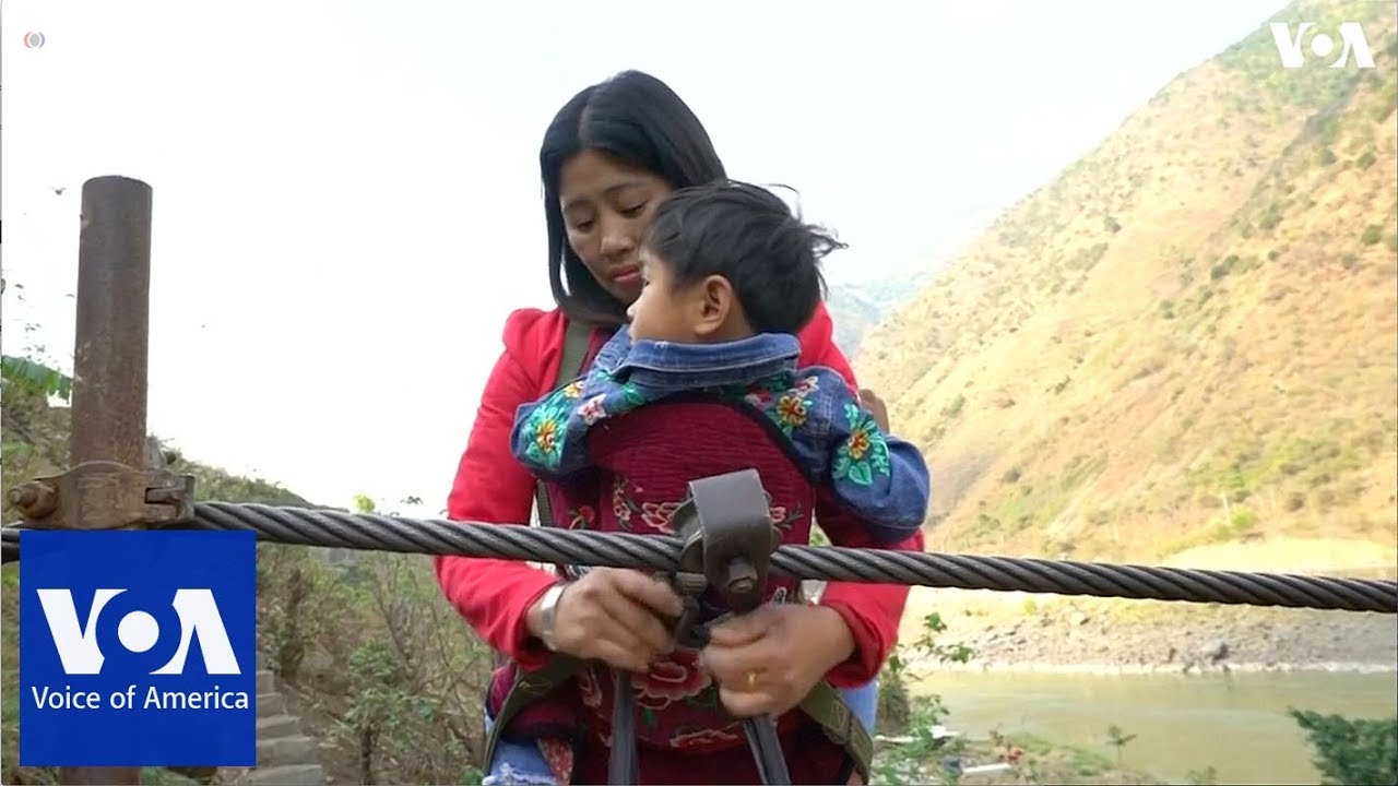 Villagers in southwest China hang on for dear life to cross rivers on ziplines