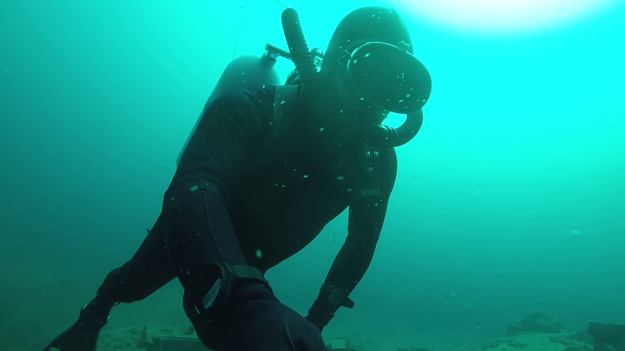 Red James Bond looking vintage wetsuit dove to 131 feet at Fortune Pond