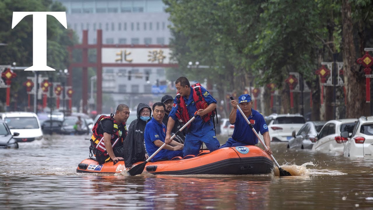 Beijing floods: emergency workers rescue trapped residents from homes