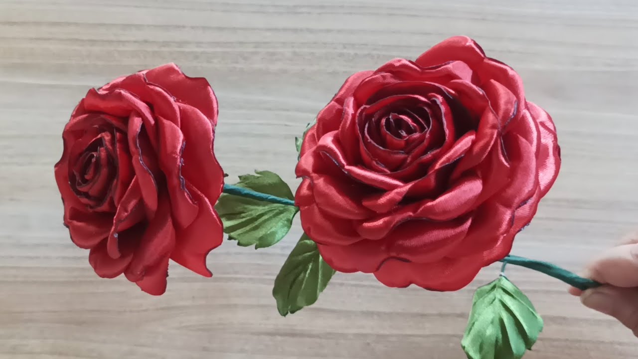 This is an artificial rose made from satin ribbon.
