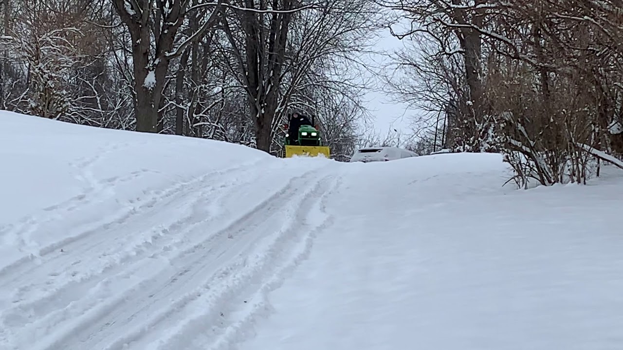 John Deere 1026R plowing snow with Versa Turf Tires