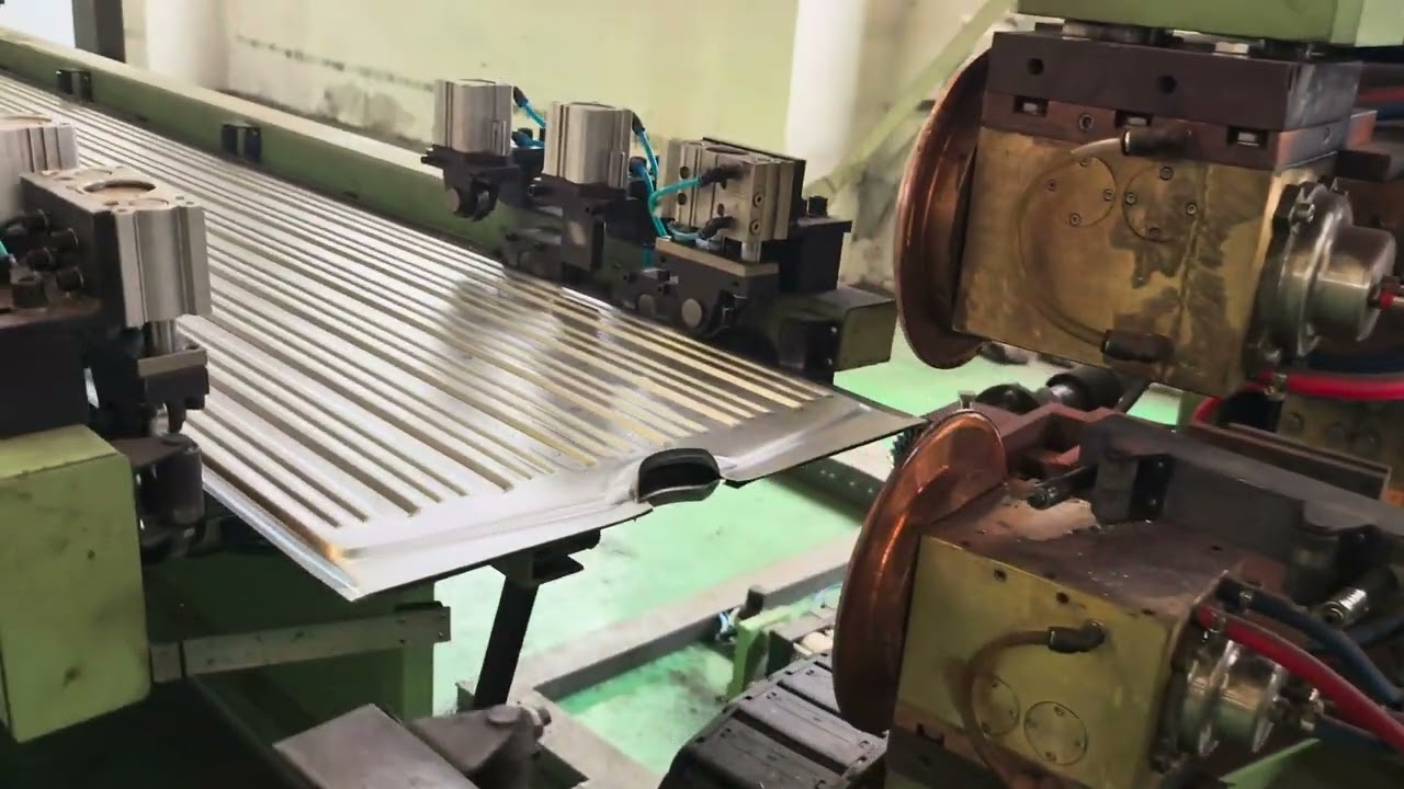 Fully automatic transformer radiator production line with robotic unloading