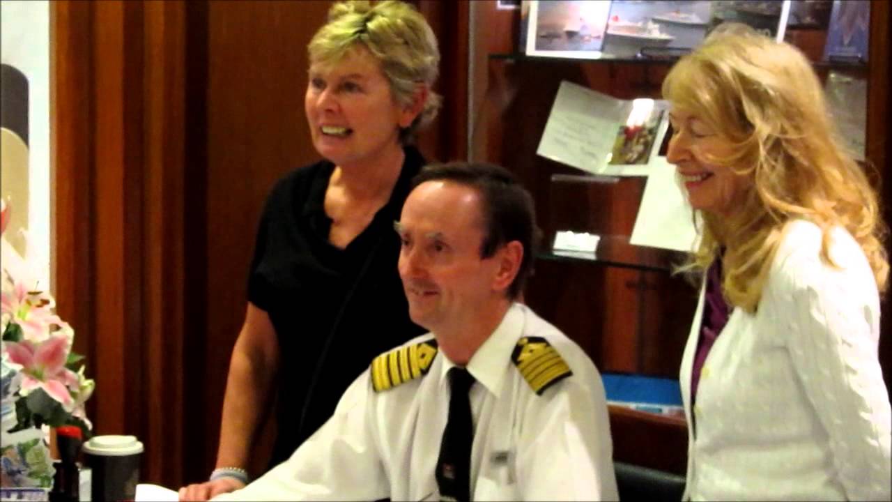 Captain Wells signs Cunard memorabilia & books for passengers on ms Queen Elizabeth