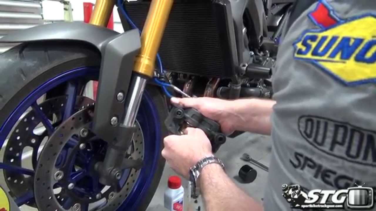 How To Replace Front Brake Pads on a Yamaha FZ-09 from SportbikeTrackGear.com