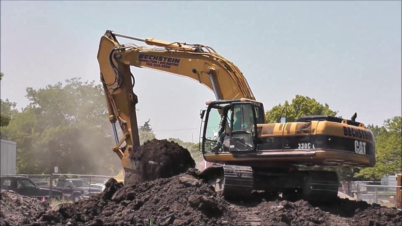 CAT 330C Excavator Digging Water Retention Pond