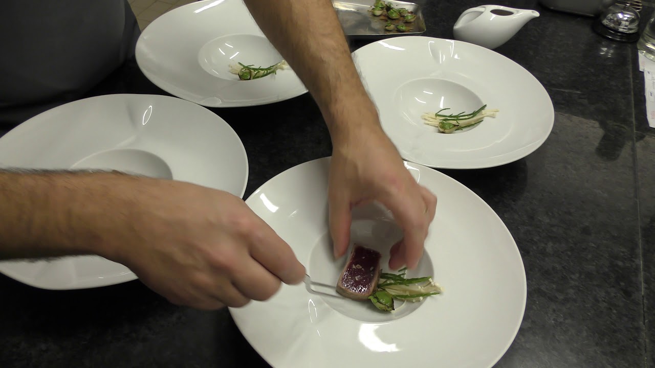 Busy kitchen service at one Michelin star restaurant Pedro Lemos in Porto, Portugal